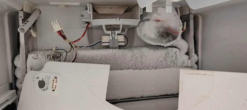 Houston homeowner reviewing refrigerator repair estimate